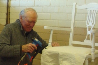 Stretching fire retardant calico on a pin-cushion seat